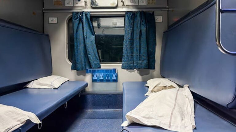 Indian Railways bedroll items including blankets and pillows inside an AC coach