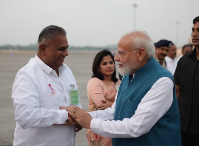 PM Modi notices Tamil Nadu CM Vijay’s photo on Minister Anand’s shirt.